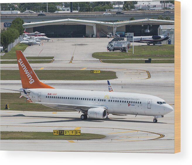 Sunwing Wood Print featuring the photograph Sunwing Airlines by Dart Humeston