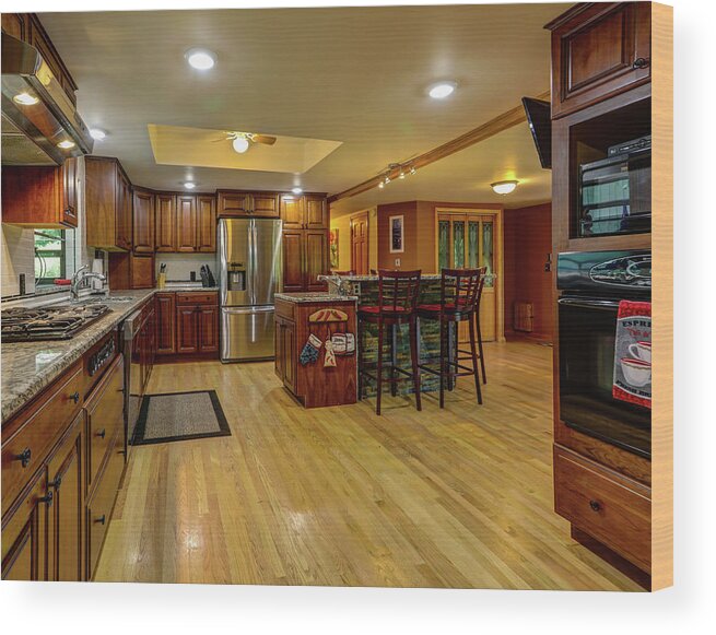 Real Estate Photography Wood Print featuring the photograph This is the kitchen and dining room of the Burns Rd Chalet by Jeff Kurtz