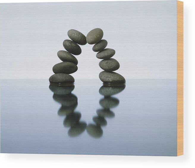 Leaning Wood Print featuring the photograph Balancing Rocks In Water, Studio Shot by Paul Taylor