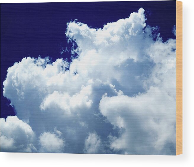Clouds Wood Print featuring the photograph Billowing Masses of Cumulus Clouds Against a Dark Blue Sky by Linda Stern