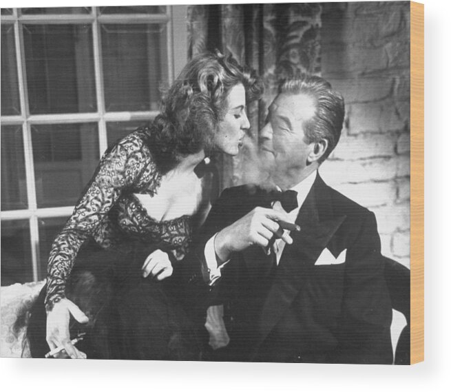 Actress Wood Print featuring the photograph Claude Rains and Corinne Calvet by Peter Stackpole