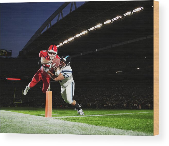 Sports Helmet Wood Print featuring the photograph Football Player Diving Into End Zone by Thomas Barwick