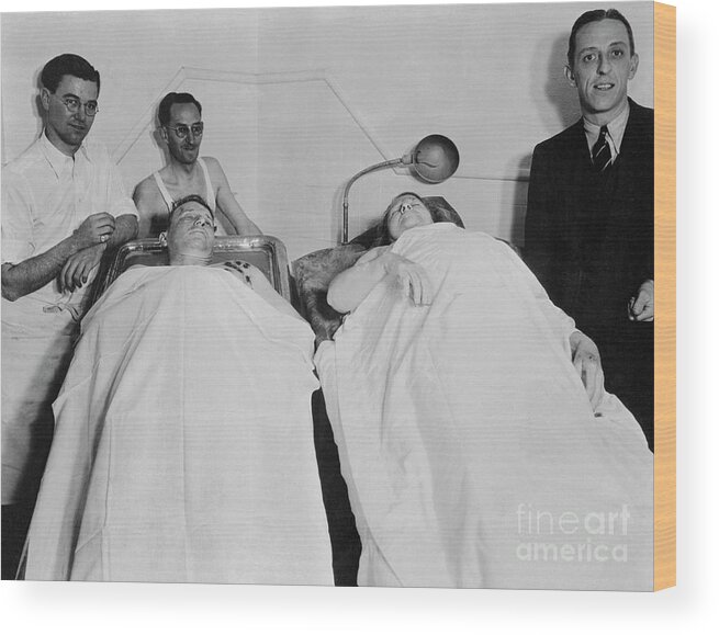 Following Wood Print featuring the photograph Fred And Ma Barker Lying In Morgue by Bettmann