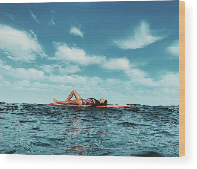 Surfer Wood Print featuring the photograph Full Body Portrait Of Female Surfer Lying On Surfboard by Cavan Images