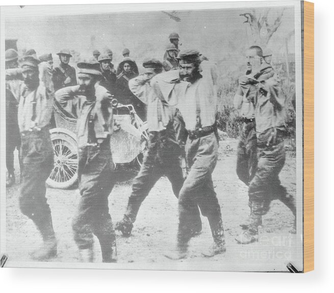 People Wood Print featuring the photograph German Pows Are Marched To Prison Camps by Bettmann