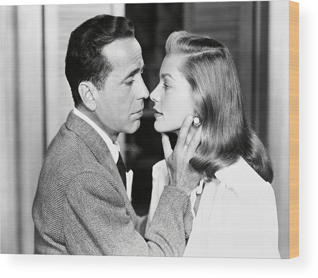 Humphrey Bogart Wood Print featuring the photograph LAUREN BACALL and HUMPHREY BOGART in DARK PASSAGE -1947-. by Album