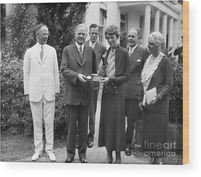 Mid Adult Women Wood Print featuring the photograph President Hoover Giving Medal To Amelia by Bettmann