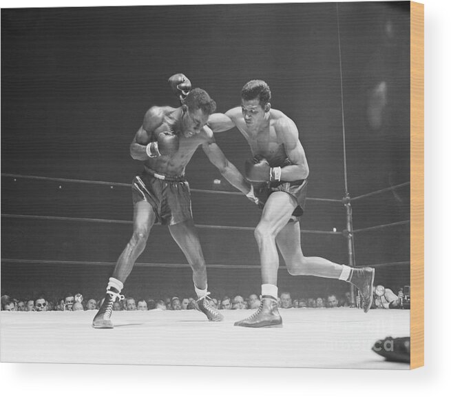 Sugar Wood Print featuring the photograph Robinson Throws Punch In Title Match by Bettmann