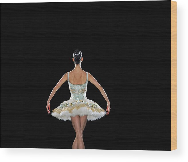 Expertise Wood Print featuring the photograph Young Female Ballerina, Rear View by Thomas Barwick