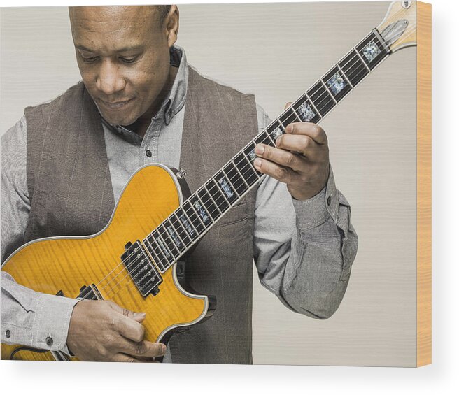 Mature Adult Wood Print featuring the photograph Black male playing guitar by Colin Hawkins
