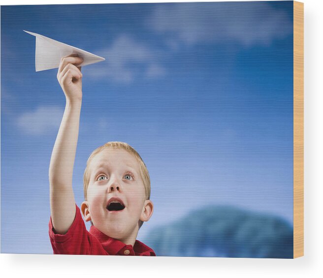 Clear Sky Wood Print featuring the photograph Boy with paper airplane outdoors by Mike Kemp