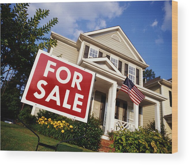 For Sale Sign Wood Print featuring the photograph House with American flag and 'for sale' sign, low angle view by Phillip Spears