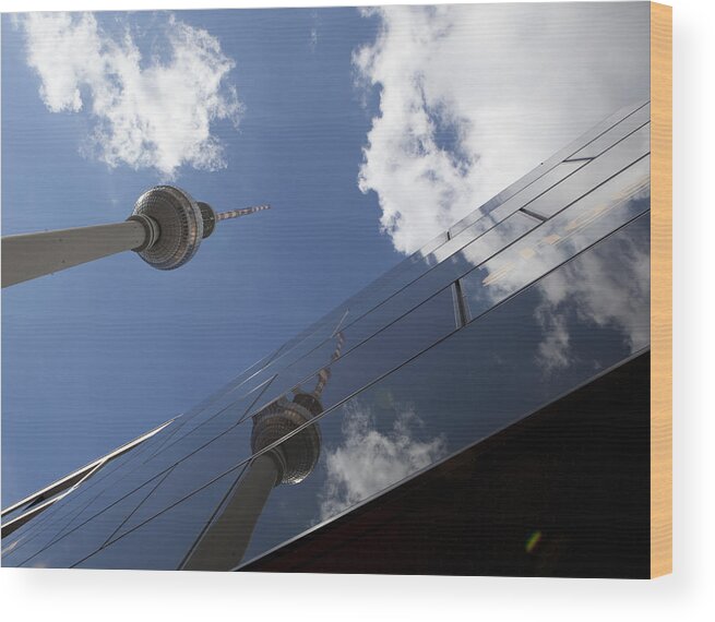 Berlin Wood Print featuring the photograph Low Angle View Of Fernsehturm Against Modern Building by Paulien Tabak / EyeEm