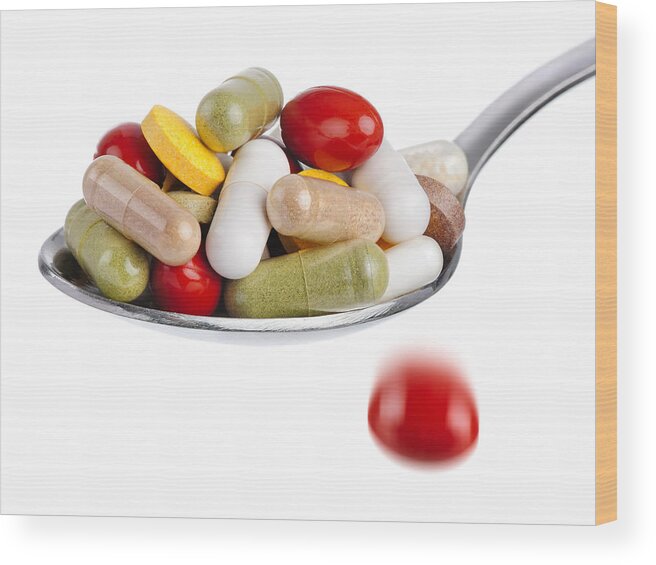Heap Wood Print featuring the photograph Spoon piled with pills by Smileus
