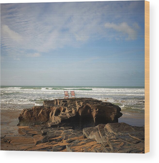 Water's Edge Wood Print featuring the photograph Deck Chairs On Coastal Rock Looking Out by Dougal Waters