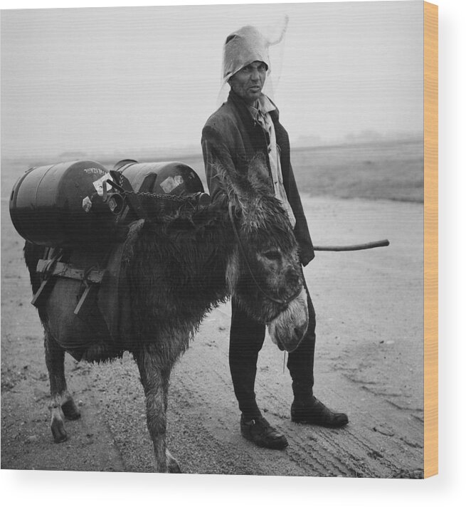 Journalism Wood Print featuring the photograph Man with donkey in communist Romania by Emanuel Tanjala