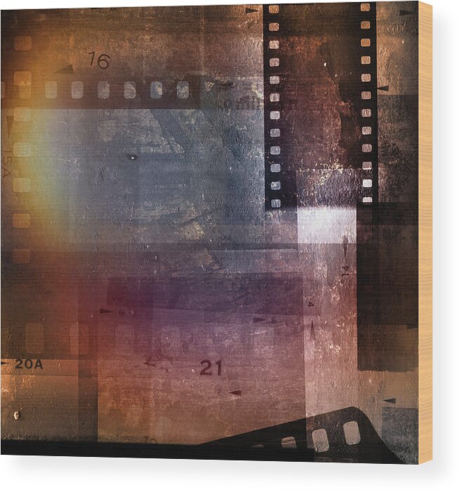 Film Frames Wood Print featuring the photograph Film strips #5 by Les Cunliffe