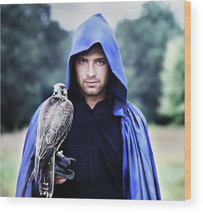 Iuliia Malivanchuk Wood Print featuring the photograph a man with a falcon by Iuliia Malivanchuk by Iuliia Malivanchuk