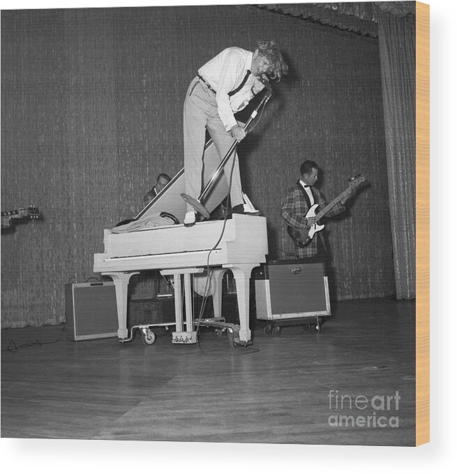 Rock Music Wood Print featuring the photograph Jerry Lee Lewis Singing Atop A Piano by Bettmann