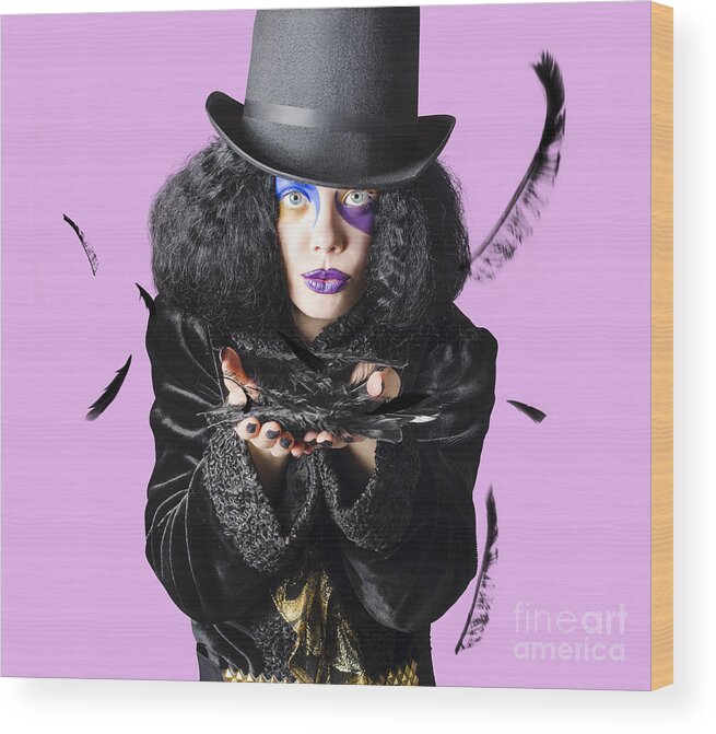Magician Wood Print featuring the photograph Magician blowing feathers by Jorgo Photography