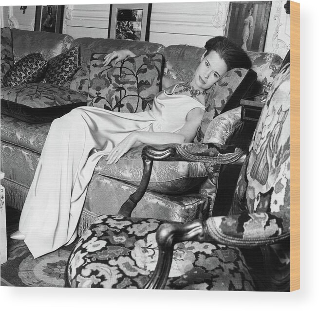 Decorative Art Wood Print featuring the photograph Gloria Vanderbilt Reclining On A Couch by Horst P. Horst