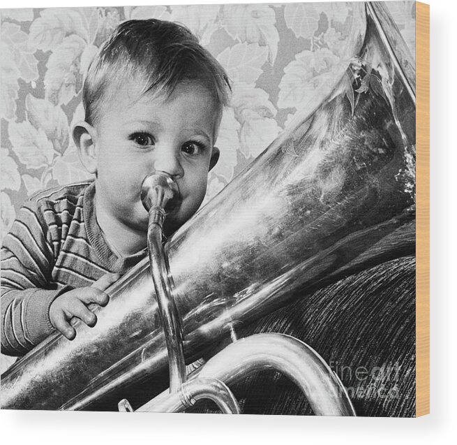 Child Wood Print featuring the photograph Boy Playing Tuba by Bettmann