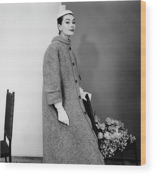 Accessories Wood Print featuring the photograph Model Wearing A Balenciaga Coat #1 by Henry Clarke