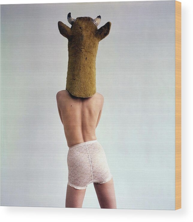 Animal Wood Print featuring the photograph Model Wearing A Cow Mask #1 by Gianni Penati