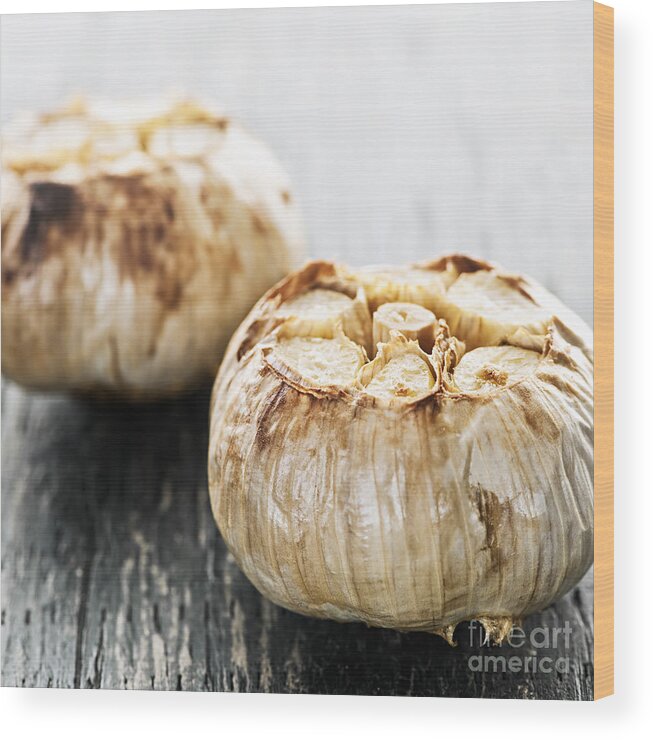 Garlic Wood Print featuring the photograph Roasted garlic bulbs 2 by Elena Elisseeva