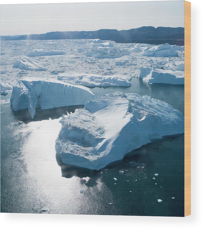 Melting Wood Print featuring the photograph Aerial Of Icebergs Of Ilulissat by Holger Leue