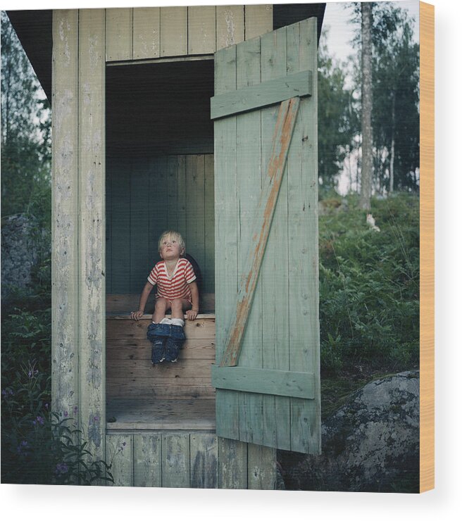 4-5 Years Wood Print featuring the photograph Boy in outhouse by Johan Willner