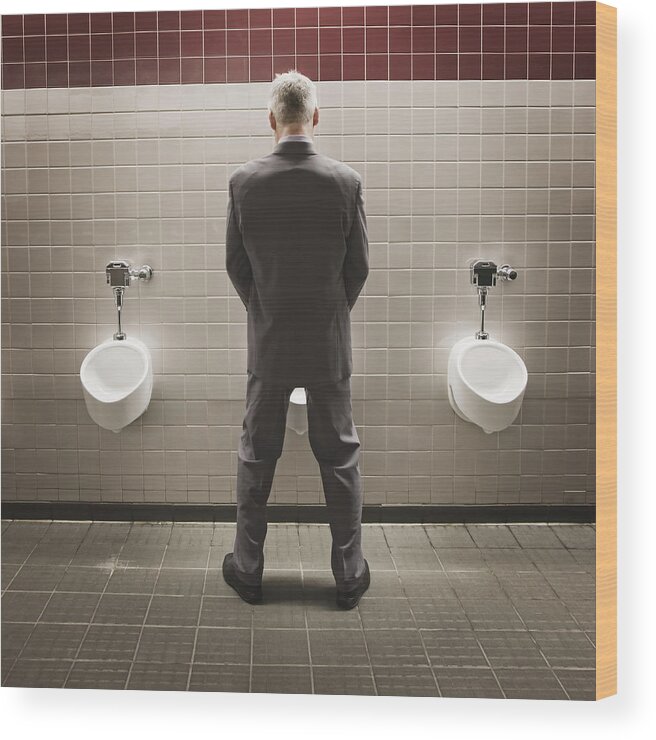 Corporate Business Wood Print featuring the photograph Caucasian businessman using public restroom by Jetta Productions Inc