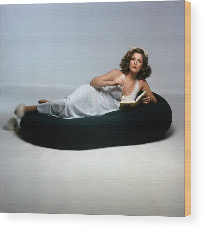 Fashion Wood Print featuring the photograph Christina Ferrare Lying On A Knoll International by Francesco Scavullo