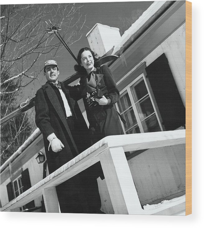 Exterior Wood Print featuring the photograph People Holding Skis On A Balcony by Toni Frissell