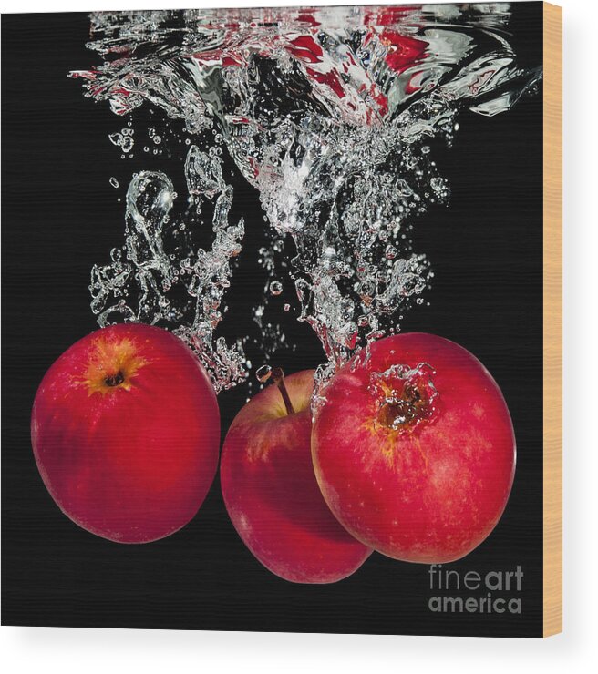 Apples Wood Print featuring the photograph Splashing apples by Mike Santis