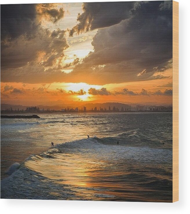 Australia Wood Print featuring the photograph Surfers Catching Some Last Waves As The by David Bostock Photography