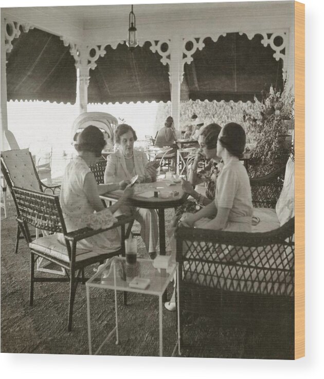 Sport Wood Print featuring the photograph Women Playing A Card Game by John Rawlings