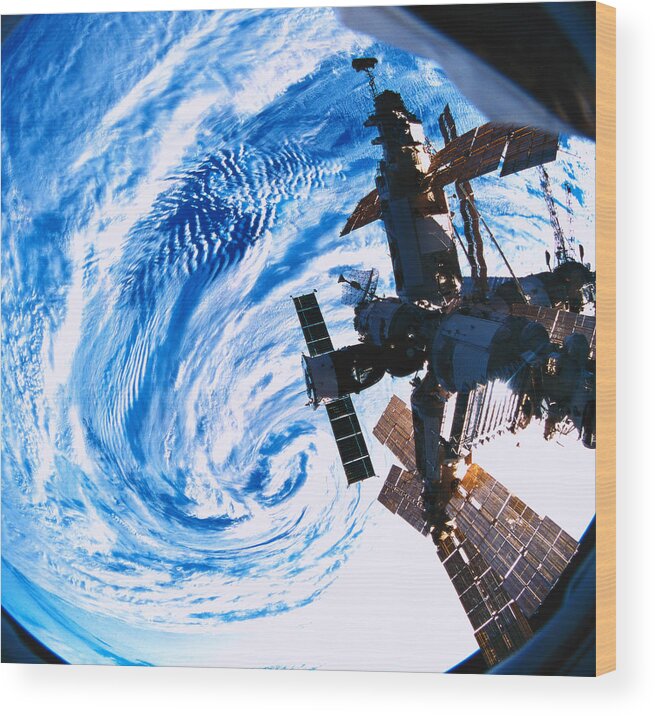 Square Wood Print featuring the photograph A Space Station Orbiting Above Earth #3 by Stockbyte