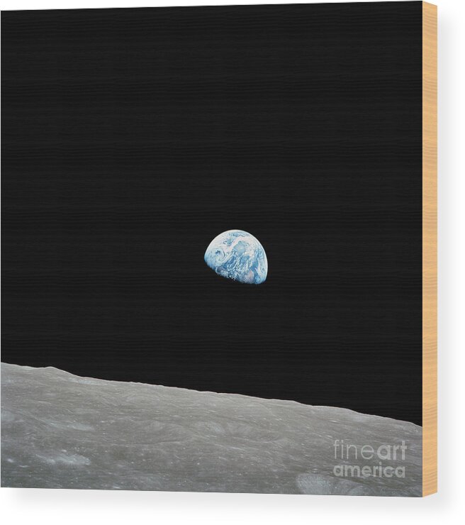 Black Background Wood Print featuring the photograph Earth Rising Above The Lunar Horizon #1 by Stocktrek Images