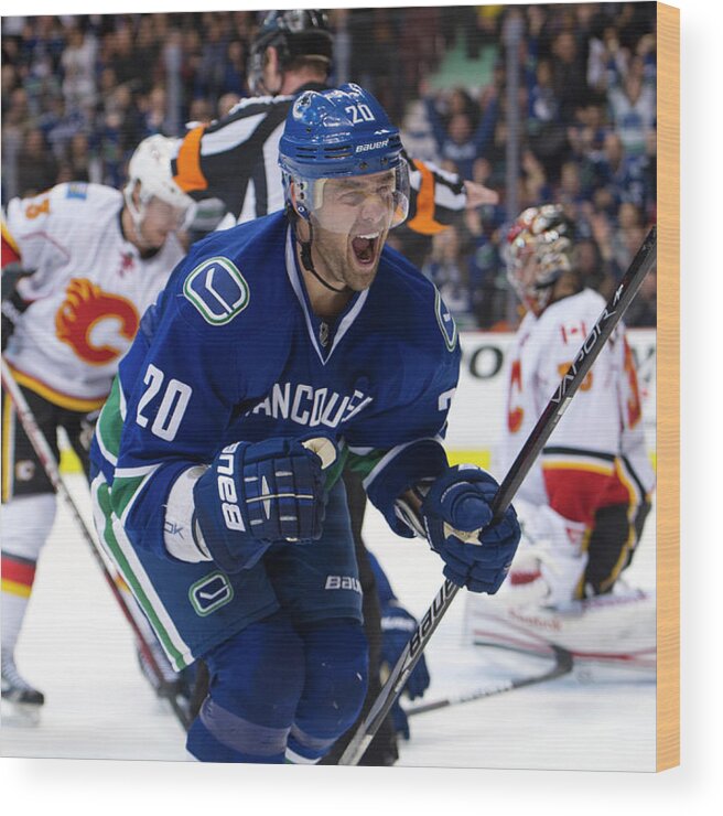 Scoring Wood Print featuring the photograph Calgary Flames V Vancouver Canucks #2 by Rich Lam
