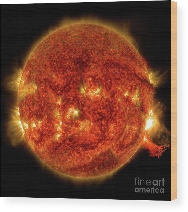 Sun Wood Print featuring the photograph Active Sun And Solar Flare by Nasa/sdo/science Photo Library