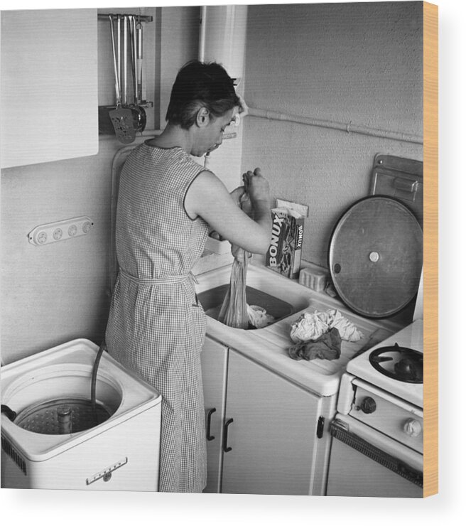 Kitchen Wood Print featuring the photograph An Housewife Makes The Washing In by Charles Ciccione