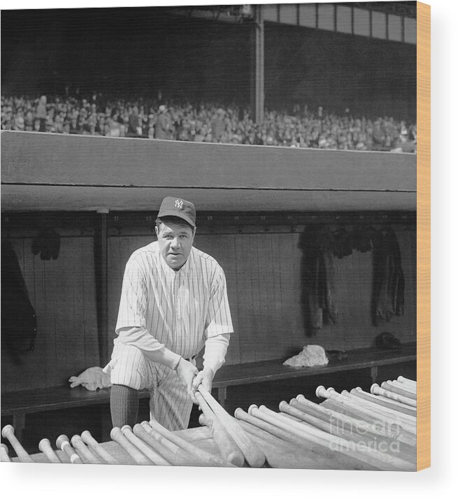 Baseball Cap Wood Print featuring the photograph Babe Ruth Holding Baseball Bats by Bettmann