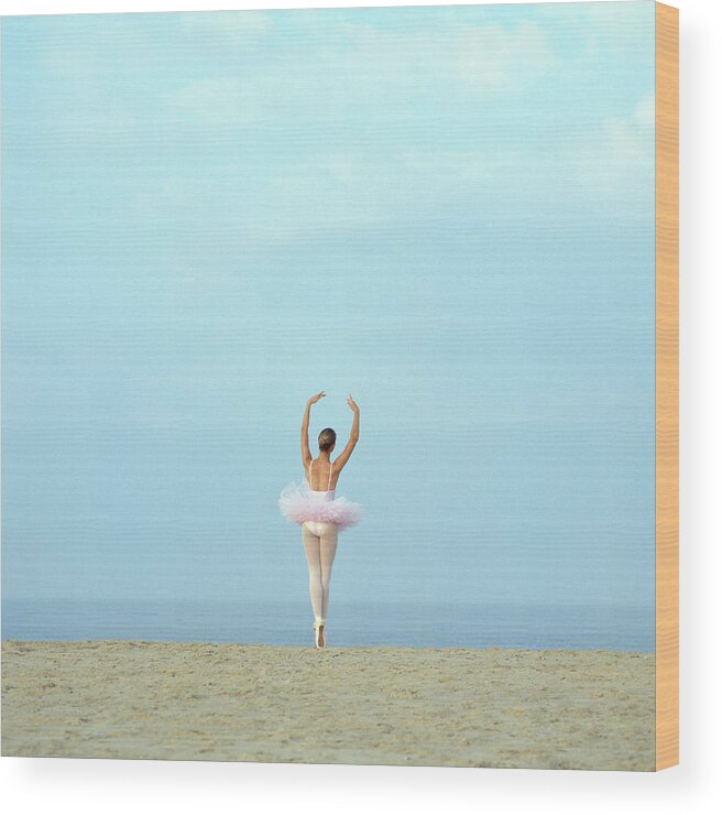 Ballet Dancer Wood Print featuring the photograph Ballerina On Beach, Rear View by Dougal Waters
