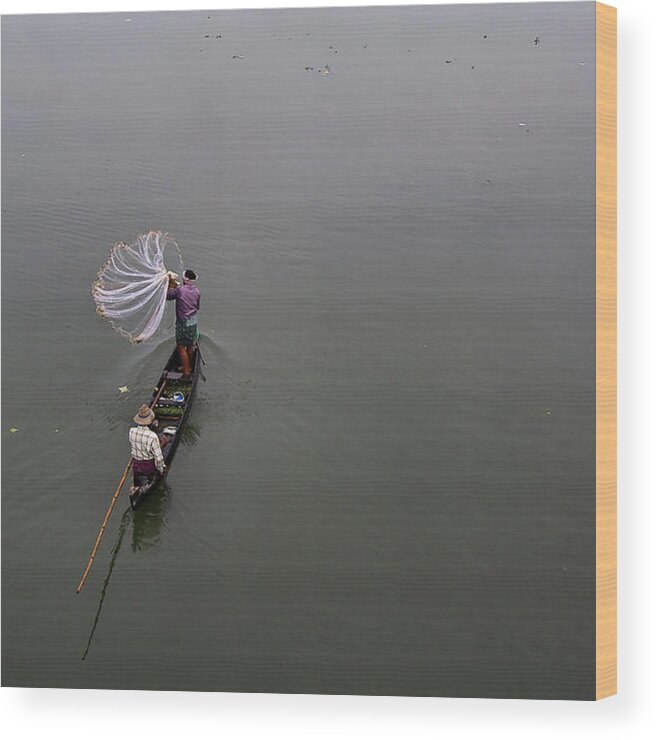 Tranquility Wood Print featuring the photograph Fisherman Throwing Net by Vinod Kumar Photography