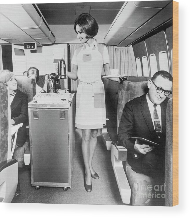 People Wood Print featuring the photograph Flight Attendant Serving Coffee by Bettmann