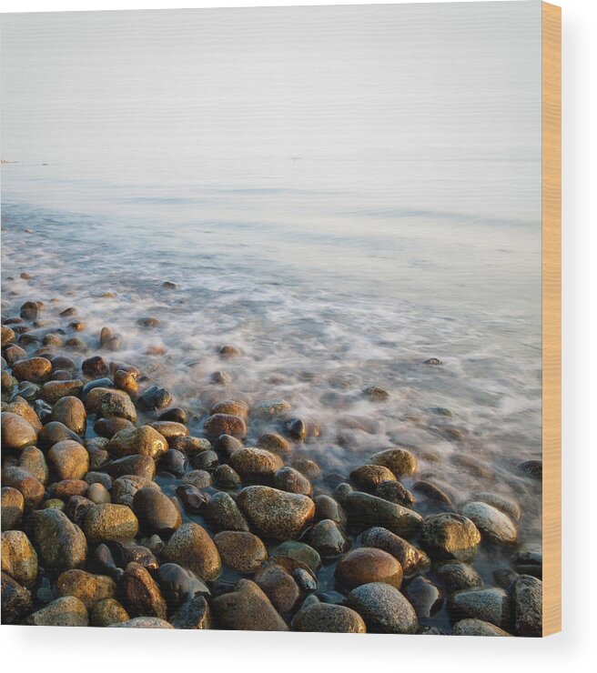 Sparse Wood Print featuring the photograph Pebble Rocks On Beach by Visualcommunications