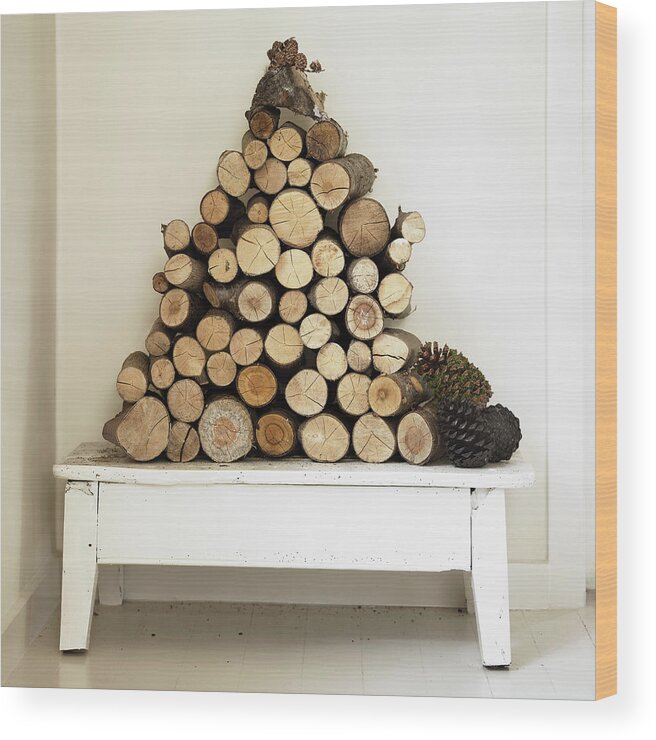 Triangle Shape Wood Print featuring the photograph Pile Of Firewood On Bench by Lisbeth Hjort
