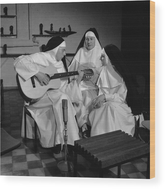 Following Wood Print featuring the photograph Practising Nuns by Keystone Features