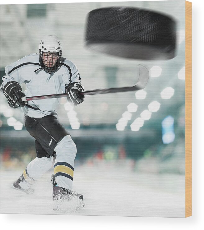 People Wood Print featuring the photograph Puck Shot By Ice Hockey Player by Bernhard Lang